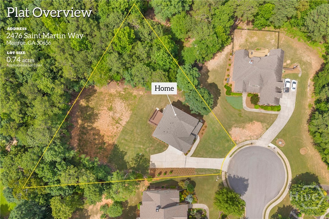 2476 St Martin Way Monroe, GA 30656 - Photo 74 of 75 Aerial overview of a 0.74-acre lot featuring a single-story residence with a gray shingled roof, an attached deck, and a concrete driveway