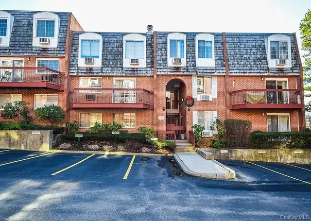 front view of a building with a garden