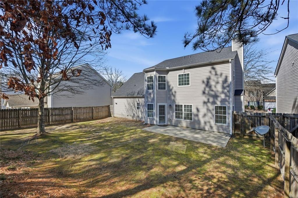 3570 Bogan Mill Road Northeast Buford, GA 30519 - Photo 28 of 31 a view of a house with a yard