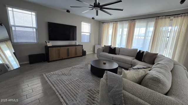 a bedroom with a bed and a television