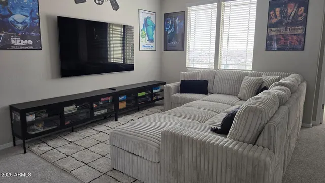 a view of a hallway with wooden floor and entryway
