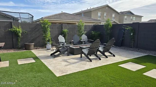 a large kitchen with stainless steel appliances kitchen island a large counter top and a stove