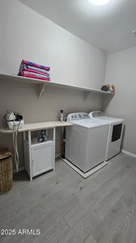 a kitchen with stainless steel appliances granite countertop a refrigerator a sink and a stove