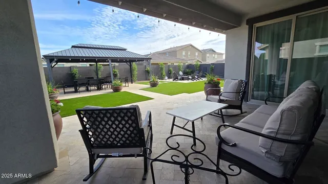 a kitchen with stainless steel appliances granite countertop a refrigerator a sink and a stove