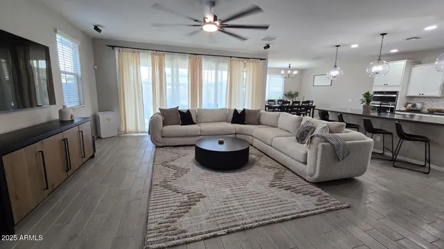 a bedroom with bed mirror and window