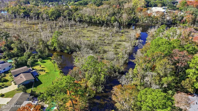 a view of lake with green space