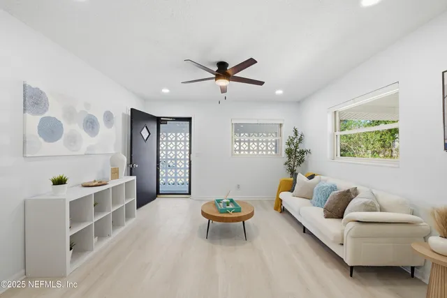 a living room with furniture and a table