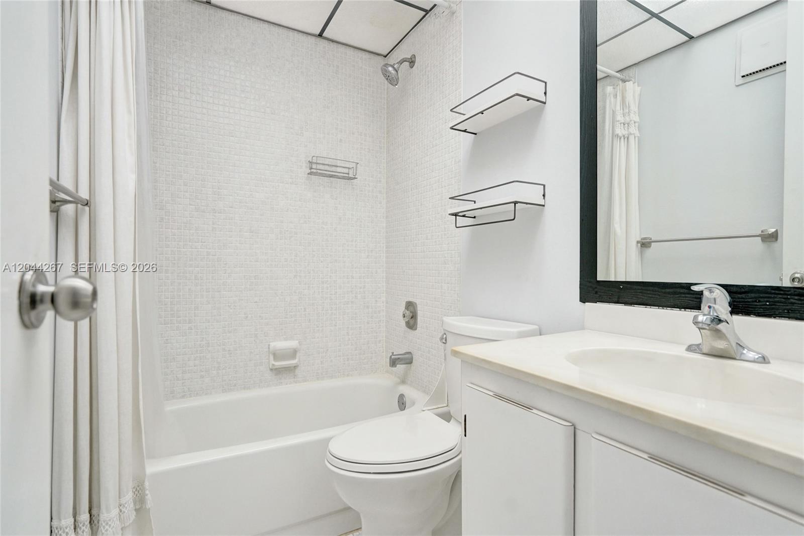 7850 West McNab Road, Unit 210 Tamarac, FL 33321 - Photo 13 of 18 Guest bathroom
