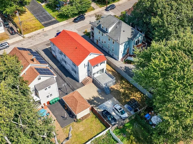 an aerial view of house with yard