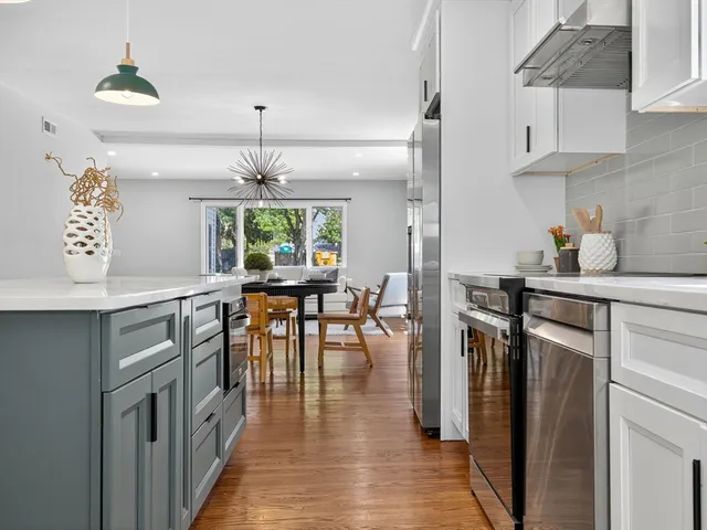 a kitchen with sink cabinets and window