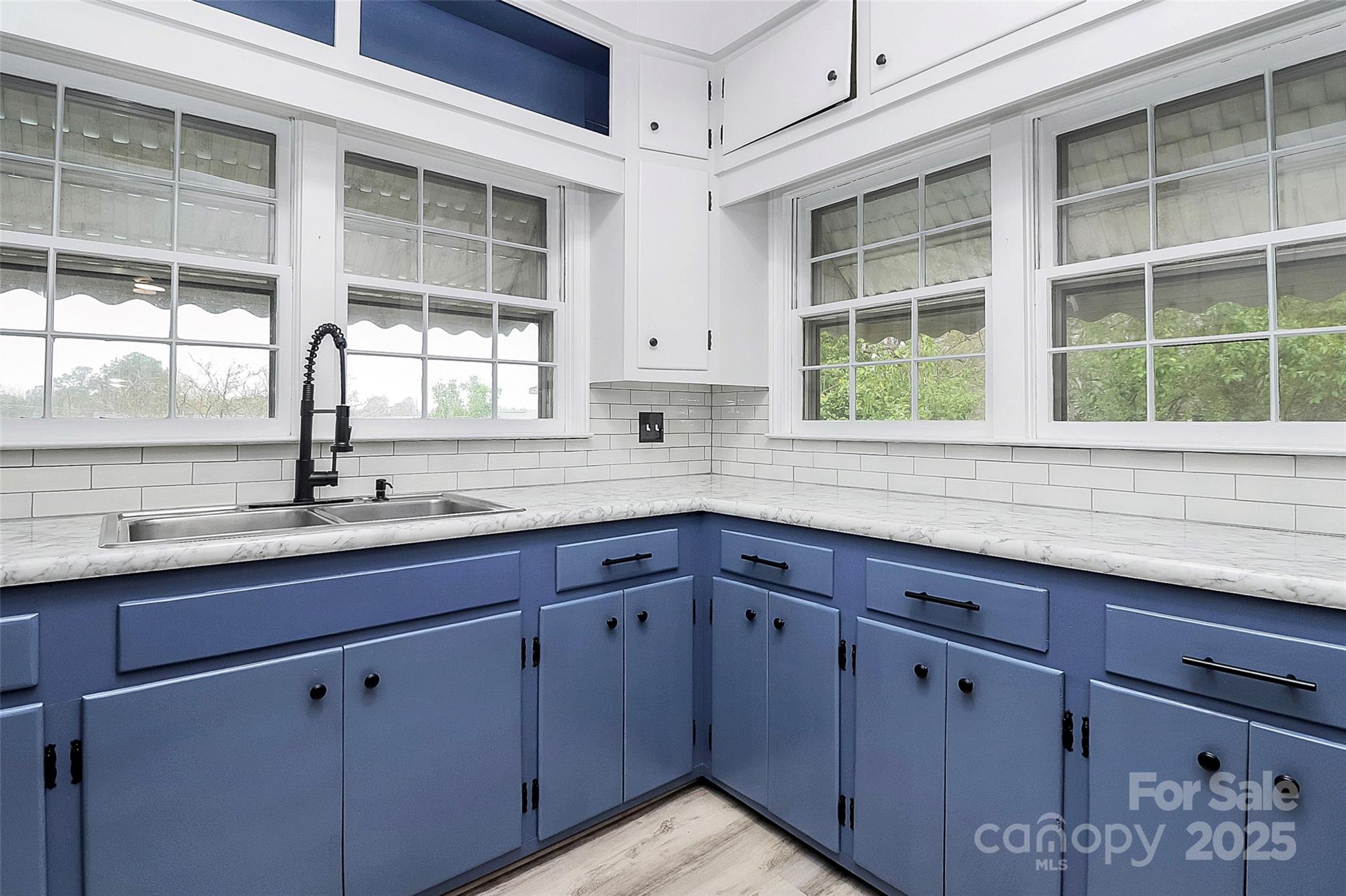 105 Deaver Street Chester, SC 29706 - Photo 12 of 41 a kitchen with stainless steel appliances granite countertop a sink and a window