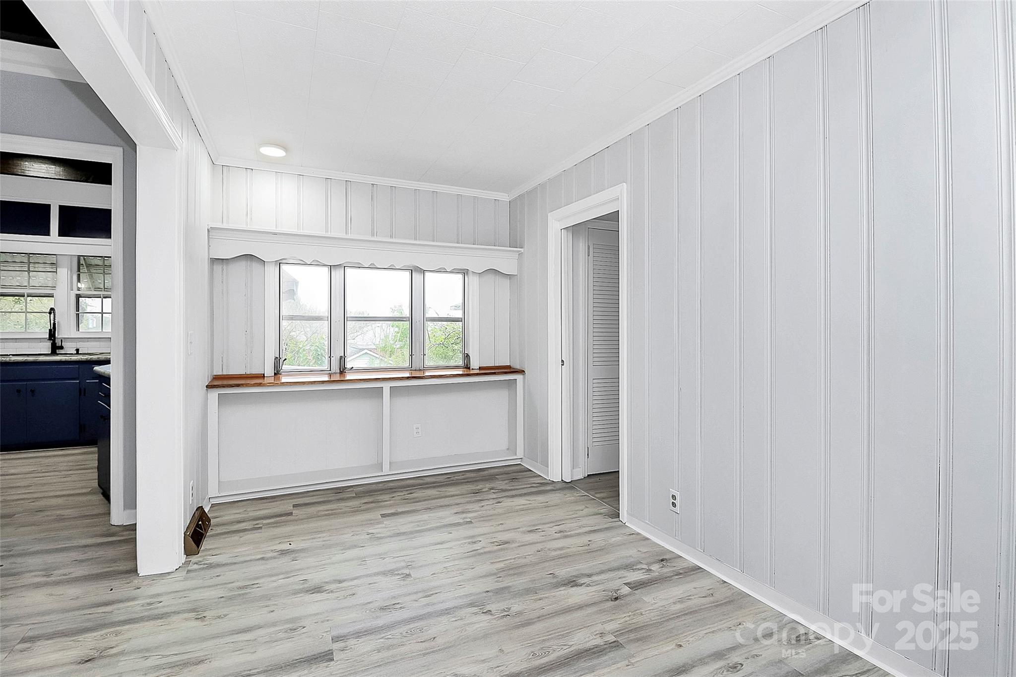 105 Deaver Street Chester, SC 29706 - Photo 15 of 41 a view of an empty room with wooden floor and a window