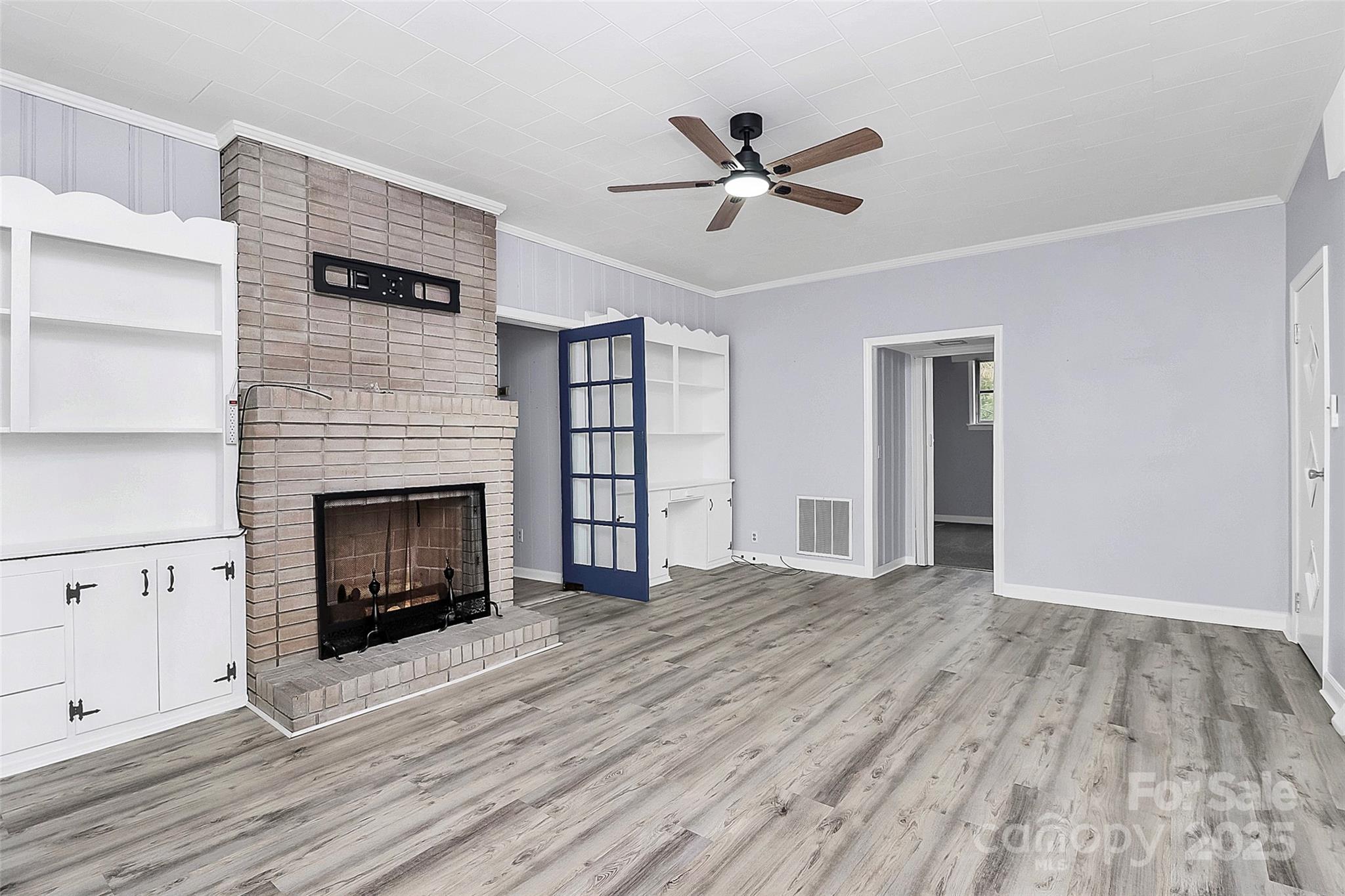 105 Deaver Street Chester, SC 29706 - Photo 20 of 41 a view of empty room with wooden floor and fireplace