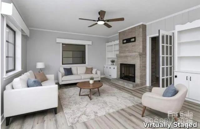 a living room with furniture and a fireplace