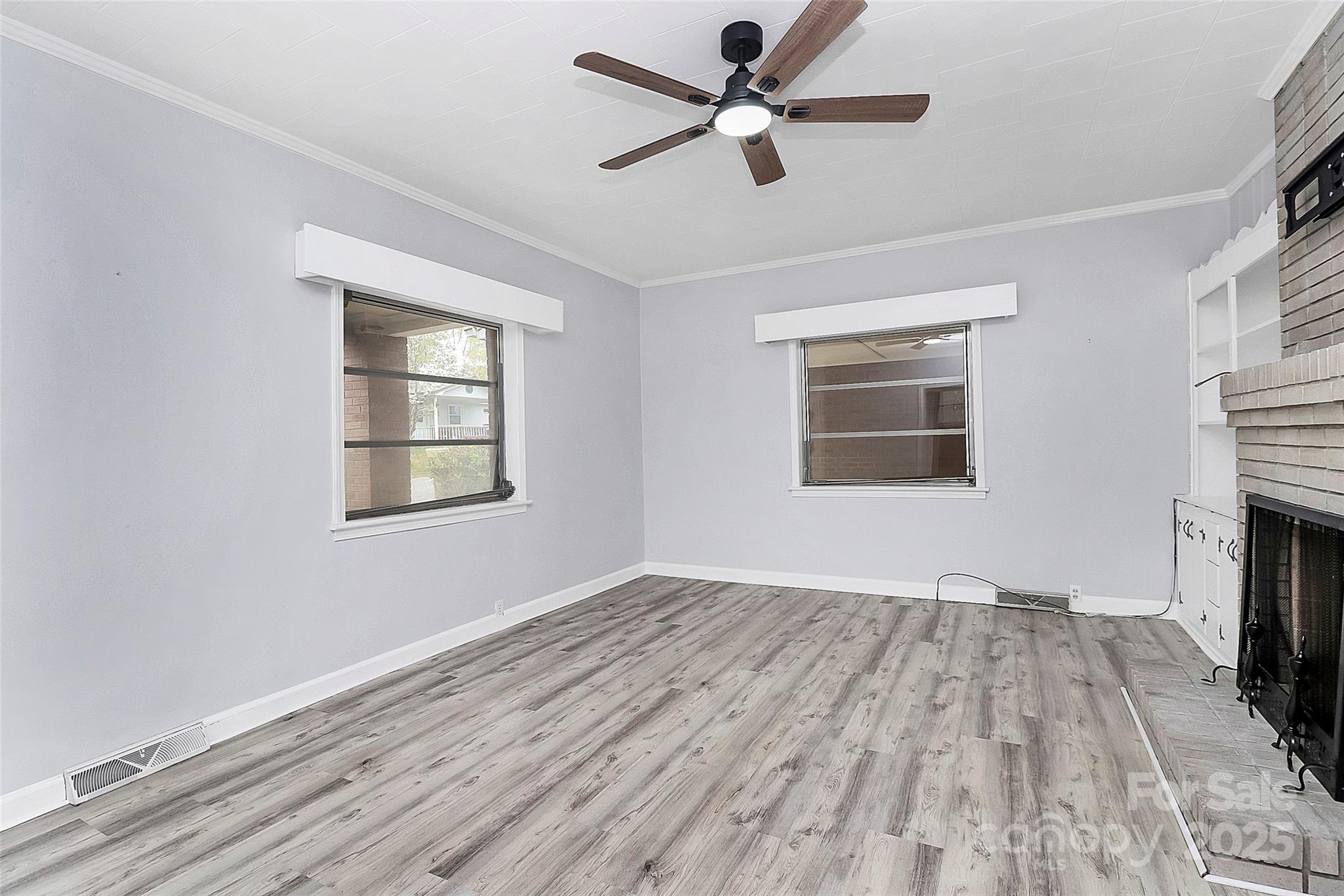 105 Deaver Street Chester, SC 29706 - Photo 24 of 41 a view of empty room with wooden floor and fan
