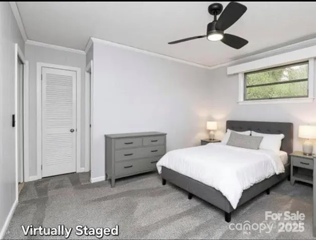 a bedroom with a bed and a ceiling fan