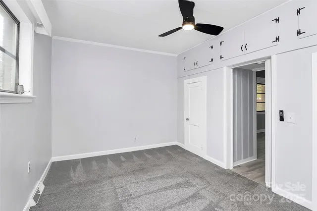 a view of empty room with windows