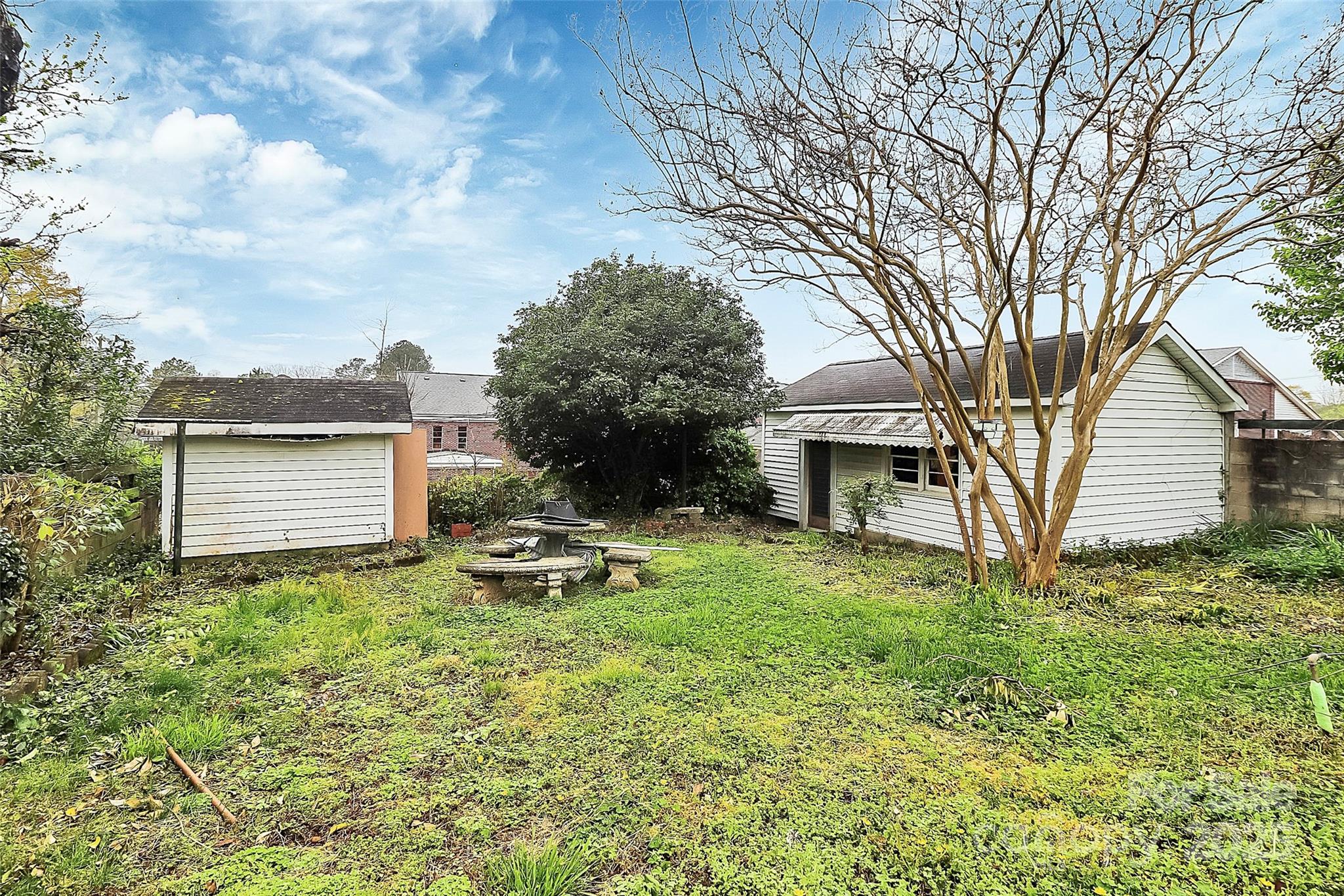 105 Deaver Street Chester, SC 29706 - Photo 41 of 41 a backyard of a house with plants and large tree