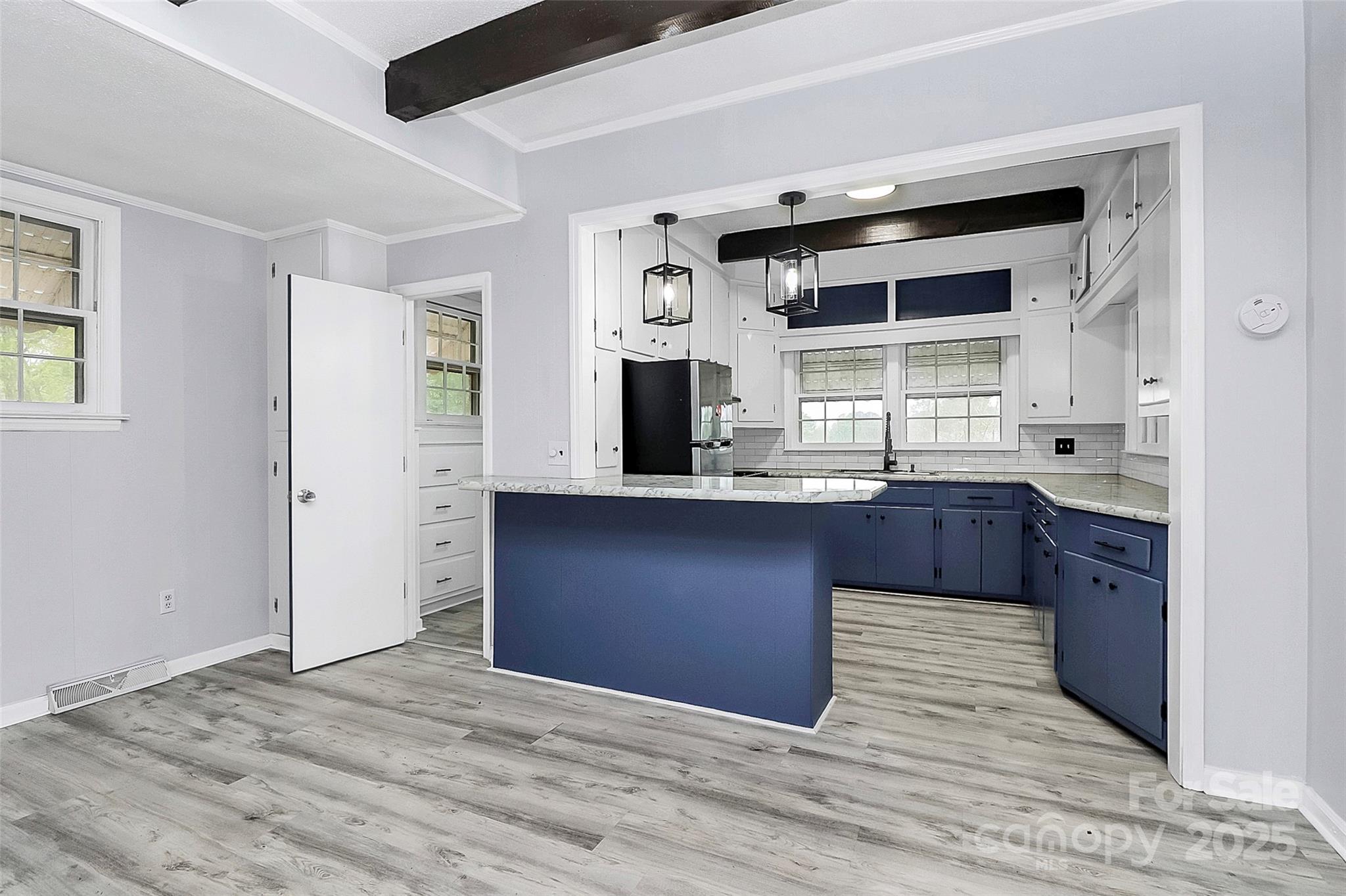 105 Deaver Street Chester, SC 29706 - Photo 7 of 41 a kitchen with granite countertop cabinets and window