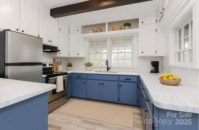 a kitchen with granite countertop a sink a stove and cabinets