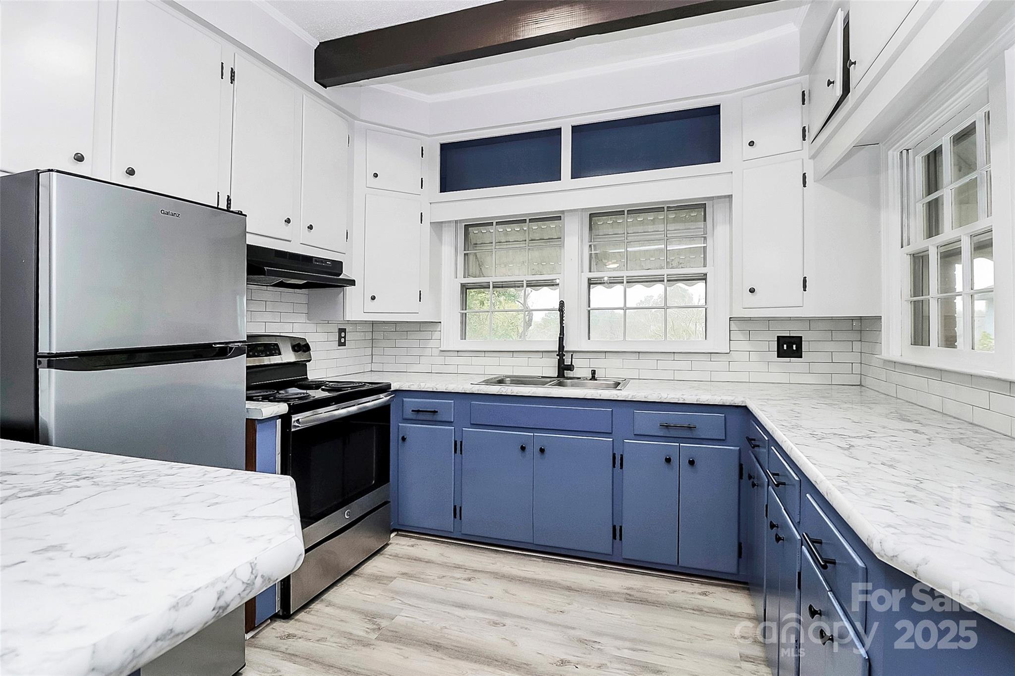 105 Deaver Street Chester, SC 29706 - Photo 9 of 41 a kitchen with stainless steel appliances granite countertop a stove a sink dishwasher and a refrigerator