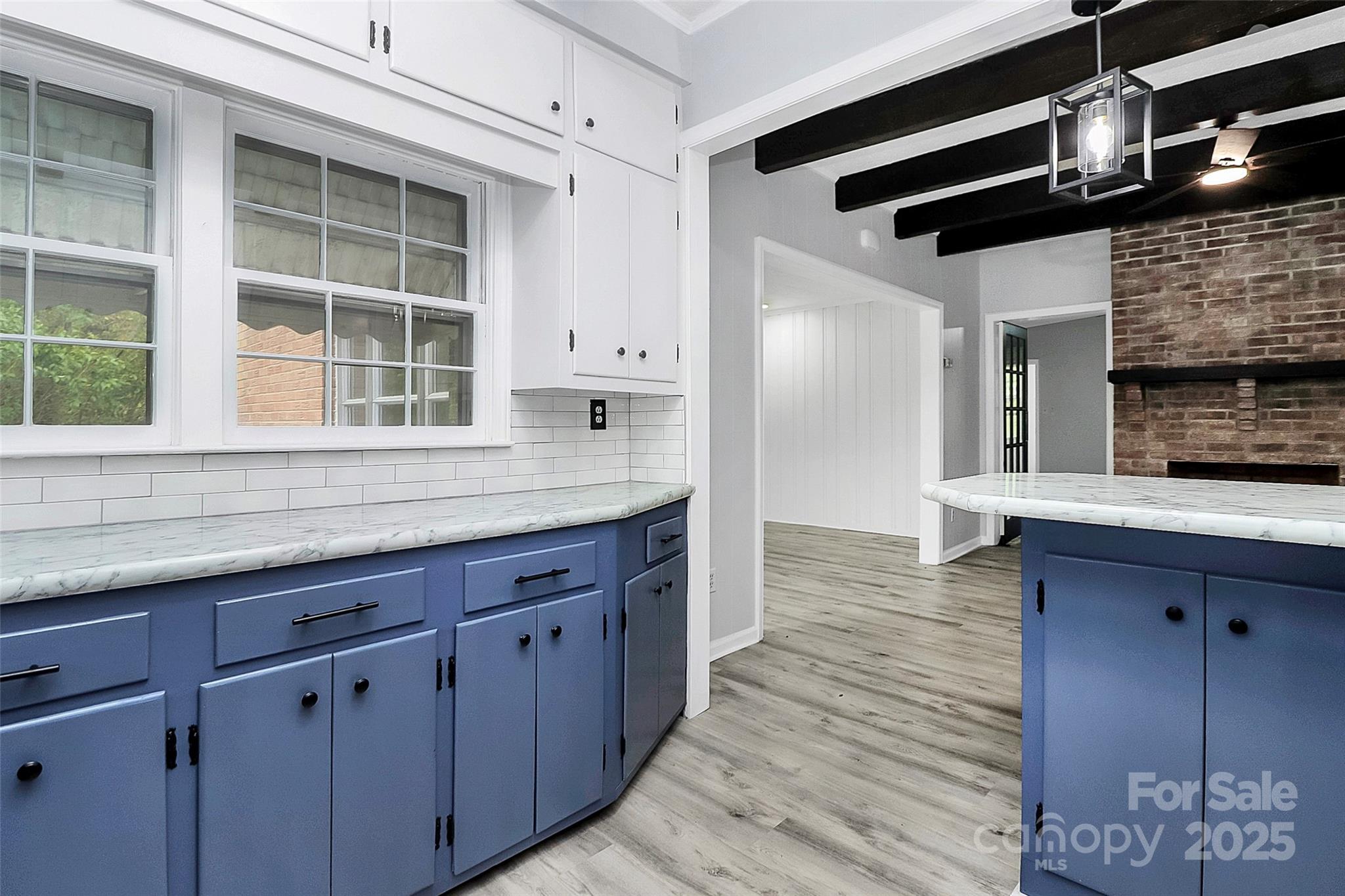 105 Deaver Street Chester, SC 29706 - Photo 10 of 41 a kitchen with cabinets and wooden floor