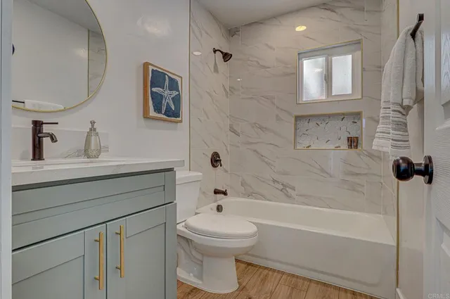 a bathroom with a sink a toilet and a bathtub