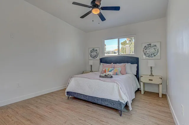 a bedroom with a bed and window