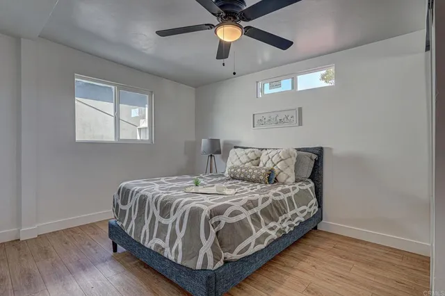 a bedroom with a bed and window