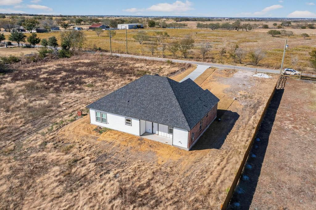 740 Section House Road Ennis, TX 75119 - Photo 30 of 31 a view of a terrace with wooden floor and lake view