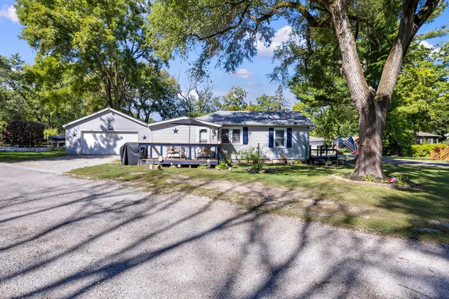 a house with swimming pool in front of it