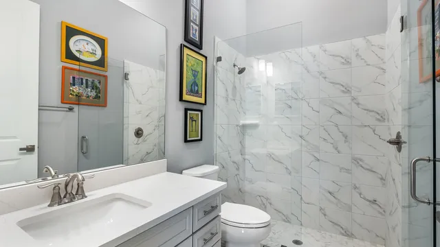a kitchen with cabinets a sink and a stove top oven with wooden floor
