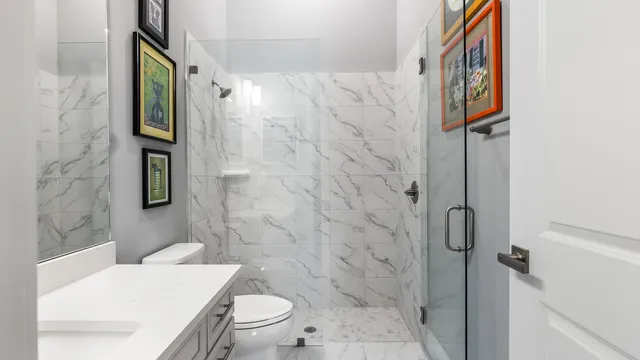 a kitchen with stainless steel appliances granite countertop white cabinets and a stove