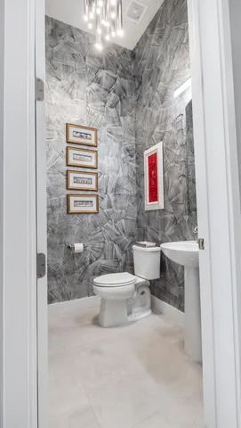 a kitchen with stainless steel appliances kitchen island granite top and refrigerator