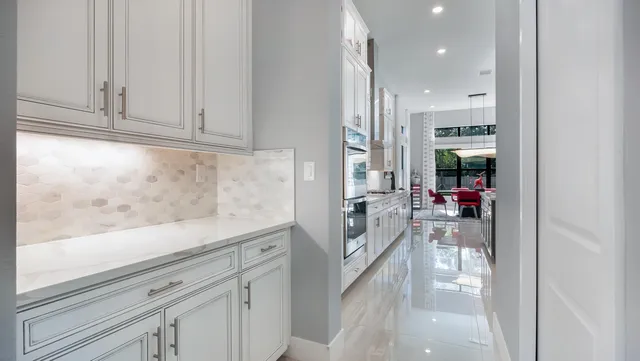 a view of walk in closet with clothes