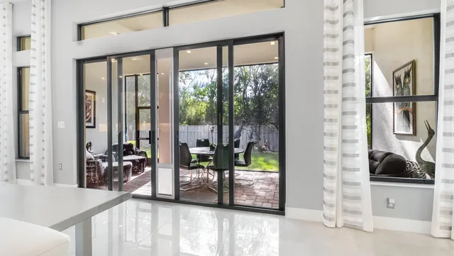 a view of backyard with a patio and outdoor seating