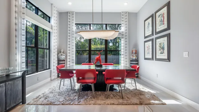 an aerial view of residential houses with outdoor space and swimming pool