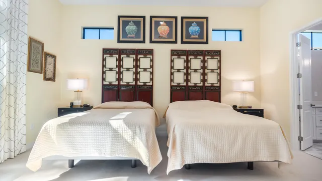 an aerial view of residential houses with outdoor space and swimming pool