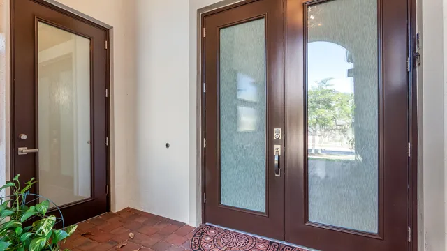 a view of a hallway with wooden floor and closet