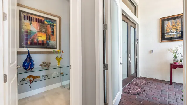 a view of kitchen with furniture and refrigerator