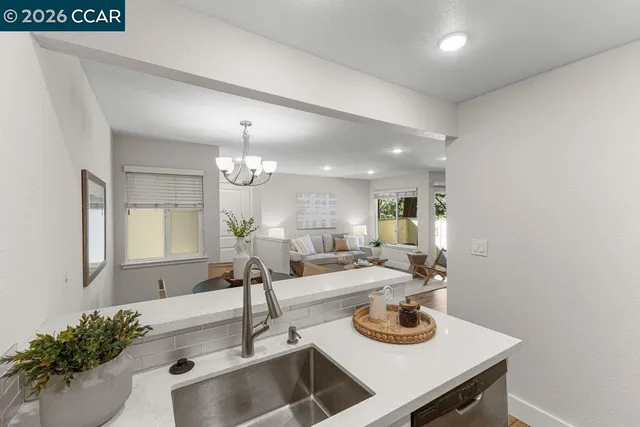 a kitchen with a sink and a refrigerator