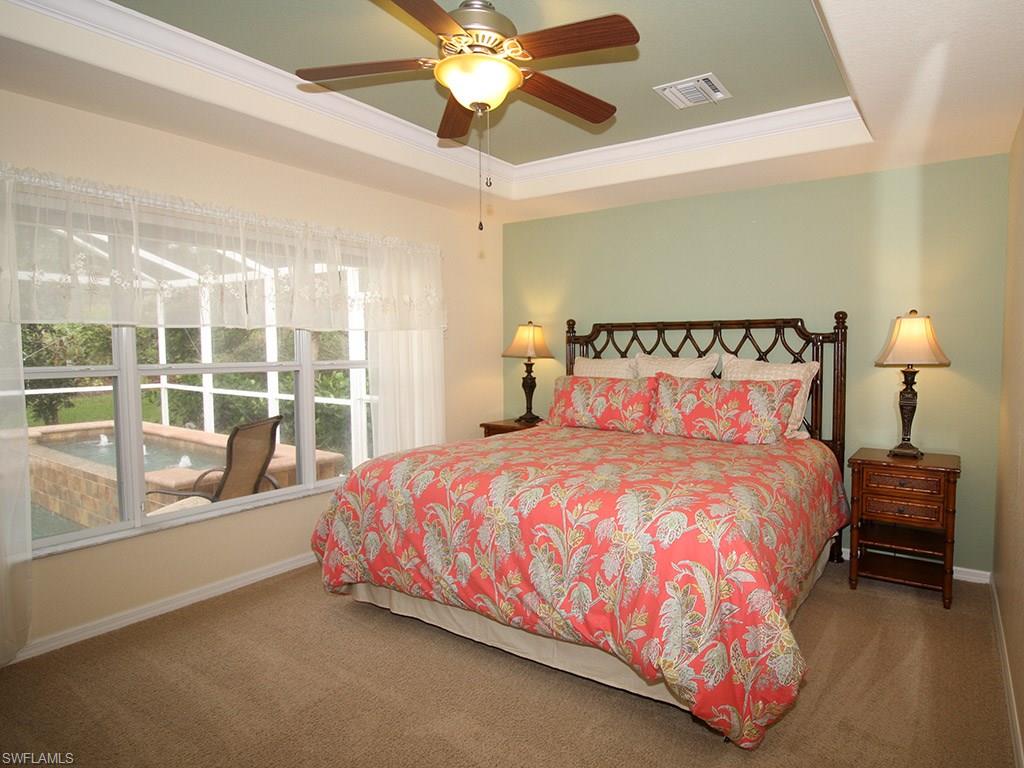 19636 Villa Rosa Loop Estero, FL 33967 - Photo 11 of 21 a large bed sitting in a bedroom next to a window