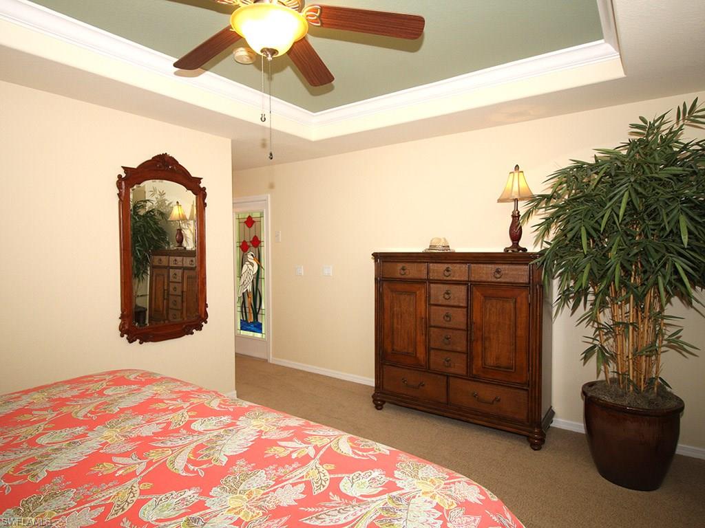 19636 Villa Rosa Loop Estero, FL 33967 - Photo 12 of 21 a bedroom with a bed and a dresser