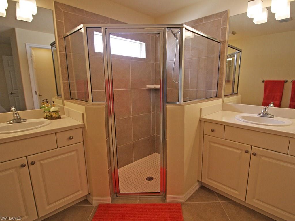 19636 Villa Rosa Loop Estero, FL 33967 - Photo 13 of 21 a bathroom with a shower sink and mirror
