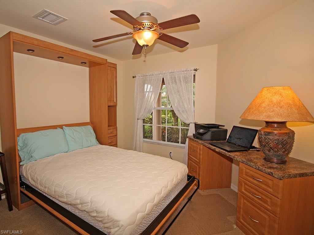 19636 Villa Rosa Loop Estero, FL 33967 - Photo 17 of 21 a bedroom with a bed and a window