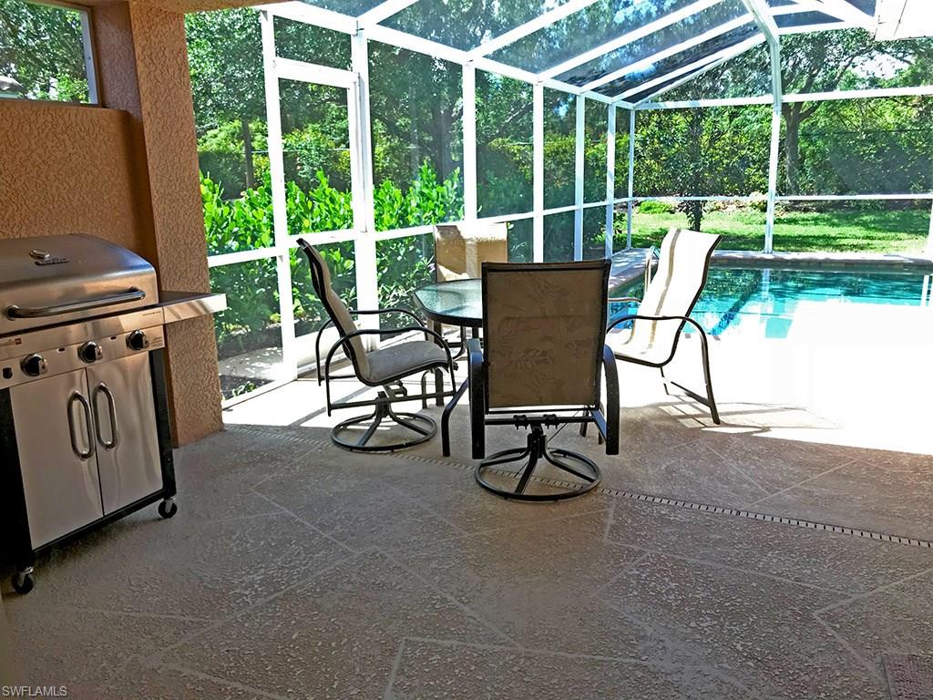 19636 Villa Rosa Loop Estero, FL 33967 - Photo 18 of 21 a view of a porch with chairs and backyard