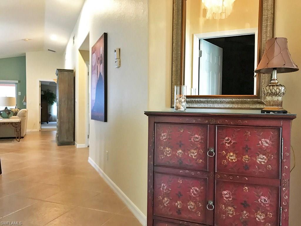 19636 Villa Rosa Loop Estero, FL 33967 - Photo 7 of 21 a view of a hallway with a door and a mirror
