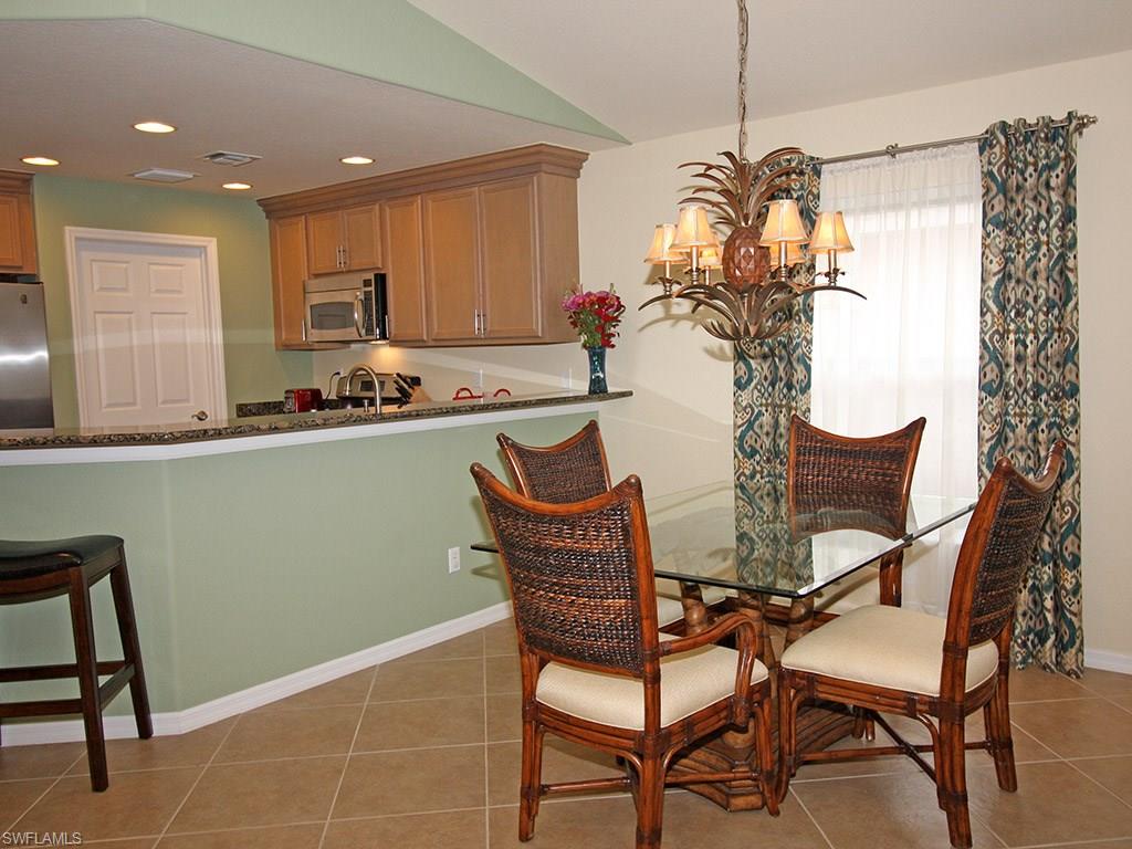 19636 Villa Rosa Loop Estero, FL 33967 - Photo 8 of 21 a view of a dining room with furniture and chandelier