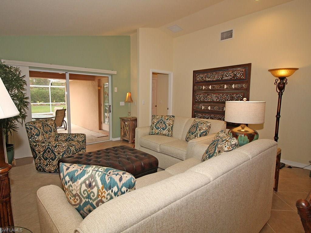 19636 Villa Rosa Loop Estero, FL 33967 - Photo 9 of 21 a living room with furniture a window and a table