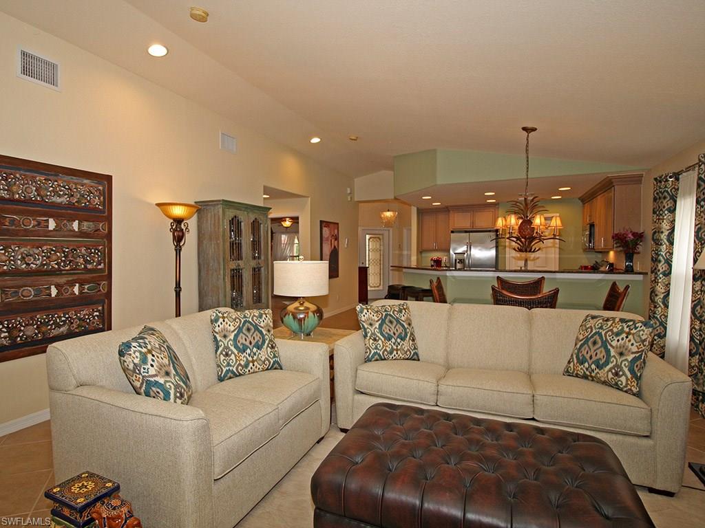 19636 Villa Rosa Loop Estero, FL 33967 - Photo 10 of 21 a living room with furniture and a chandelier